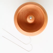 Rotating pot for attaching beads to string